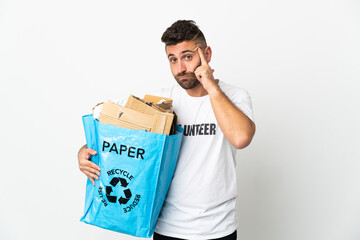 Caucasian man holding a recycling bag full of paper to recycle isolated on white background thinking an idea
