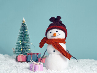 Christmas background with toy snowman.