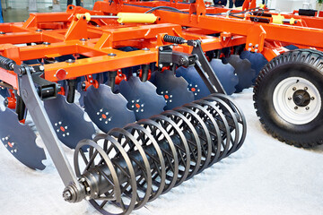 Rollers on disc harrow for agricultural business