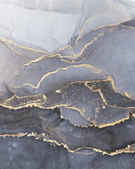High resolution. Luxury abstract fluid art painting in alcohol ink technique, mixture of black, gray and gold paints. Imitation of marble stone cut, glowing golden veins. Tender and dreamy design. - 392838520