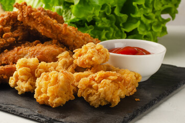 Fried chicken with french fries and nuggets.
