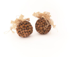 Christmas bauble decorated with acorn hats with jute material bow. Christmas balls made of acorns. Natural  materials ideal for making Christmas decorations. Rustic style. Natural Eco friendly Xmas. 