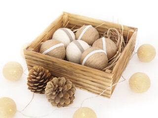 Rustic burlap for Chrismas decoration. Baubles from jute twine in wooden box. Beautiffull decoration in natural style. Handicraft. Christmas Ornament, Rustic.
