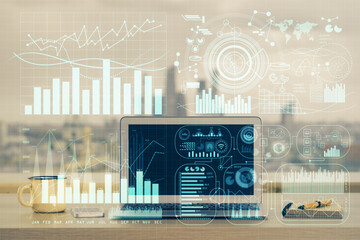 Financial chart drawing and table with computer on background. Multi exposure. Concept of...