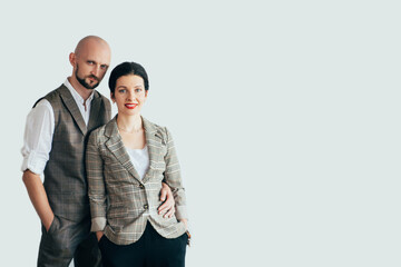 Smart casual elegance. Family look. Couple fashion style. Confident man and woman in trend outfit hands in pocket isolated on white copy space. Advertising background.