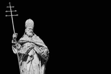 Pope Sylvester I statue with cross, at the top of St Sylvester Church in Rome, erected in the 18th...