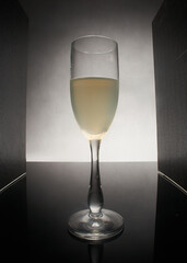 glas of white wine sided sided with black borders