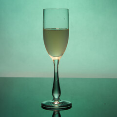 glass of wine with green backround