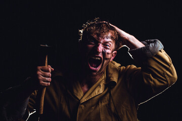 Aggressive man. Dark background. Angry man. Male. 
