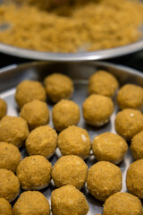 
besan laddoos are being made for festivals in india