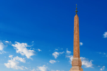 Egypt in Rome. Salustiano Obelisk among clouds, an ancient roman copy built in the 3rd century AD, now at the top of Spanish Steps (with copy space)