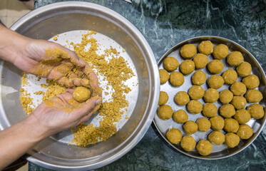 
besan laddoos are being made for festivals in india