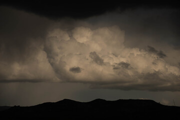 big cloud over mountain landscape