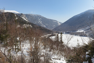 New Hampshire mountains - Cannon and Lafayette, Franconia Notch State Park. Snowy hills and rocks.