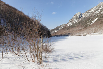 New Hampshire mountains - Cannon and Lafayette, Franconia Notch State Park. Snowy hills and rocks.