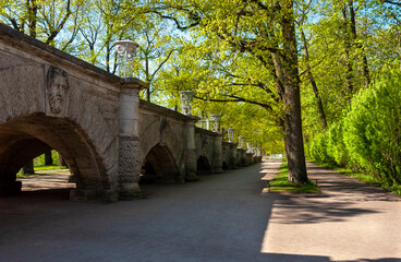 Stone inclined ramp with sculpture and flower vases. Leads to the park from the second floor. Shady...