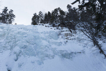 Frozen Waterfall Arethusa under ice and snow in the winter