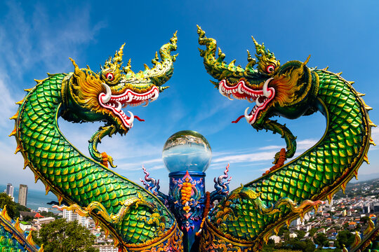 Two green head Serpent statue at Wat Phra Kru and big crystal ball view reflection of the SRIRACHA city,Thailand,ASIA.