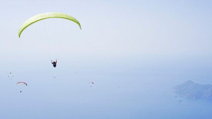 Paragliding in Oludeniz. Parachute in the sky