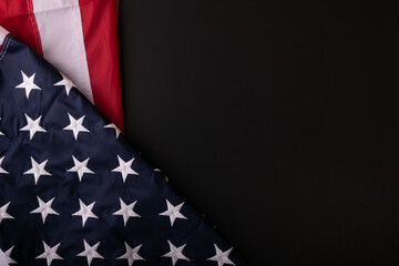 American flag on dark background with copy space. American Culture. Top View.