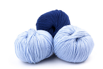 woolen merinos blue threads on white background. natural wool. knitting. background