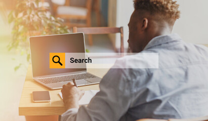 Internet Search Box Over Shot Of African Guy Using Laptop