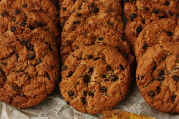 Delicious oatmeal cookies with chocolate on the table