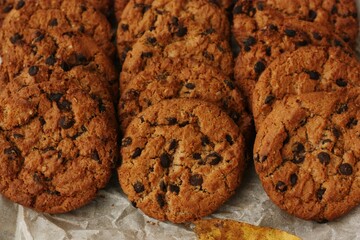 Delicious oatmeal cookies with chocolate on the table