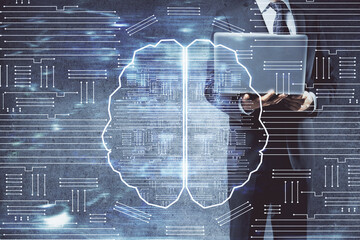 Businessman with computer background with brain theme hologram. Concept of brainstorm. Multi exposure.