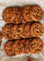 Delicious oatmeal cookies with chocolate on the table
