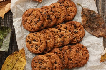 Delicious oatmeal cookies with chocolate on the table