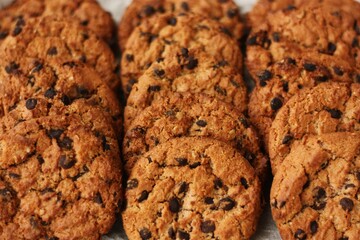 Delicious oatmeal cookies with chocolate on the table