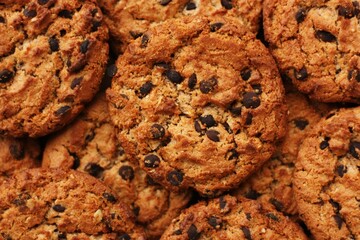 Delicious oatmeal cookies with chocolate on the table