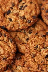 Delicious oatmeal cookies with chocolate on the table