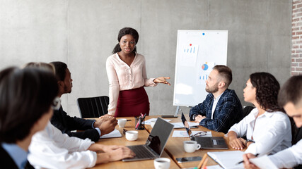 African American Businesswoman Giving Speech During Corporate Meeting In Office