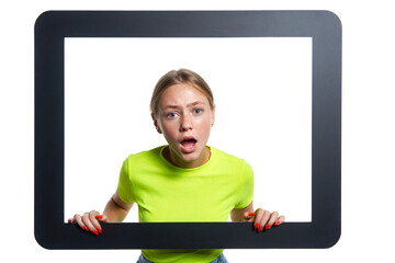 Indignant girl peeking through digital tablet frame