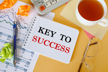 Business concept - notebook writing Key to success