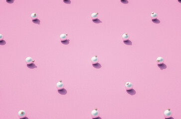 Silver matt Christmas balls on pink background