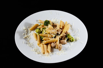 photography of a plate of macaroni with broccoli and sausages