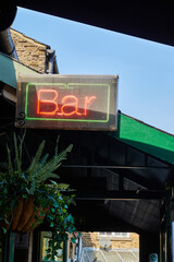 photograph of a bar sign