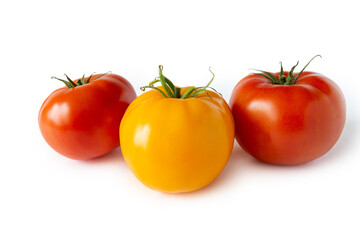 Three Juicy wet tomatoes isolated on white background. Red and yellow in the middle.