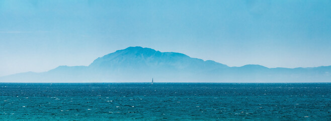 Tarifa, Spain. Oast Of Africa, Which Can Be Seen From Tarifa - The Southernmost Point Of Spain And Europe. Distance To Africa Is 20 Km By Sea. Landscape In Light Haze