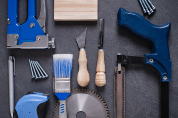 Blue set of work construction tools on the table