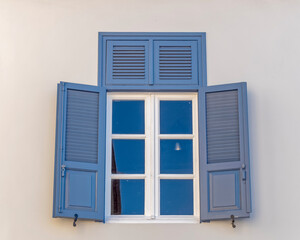 vintage blue shutters with white frame window, Athens Greece