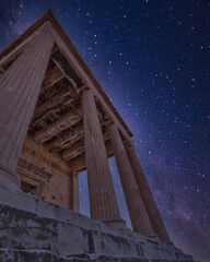 night in Athens Greece, ionic order ancient temple on Acropolis and starry sky background