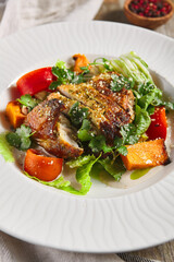 Chicken fillet with baked vegetable salad
