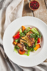 Chicken fillet with baked vegetable salad