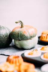 Homemade pumpkin muffins on a light table