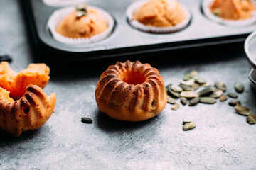 Homemade pumpkin muffins on a light table