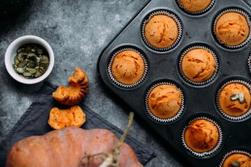 Fototapeta na wymiar Homemade pumpkin muffins on a light table